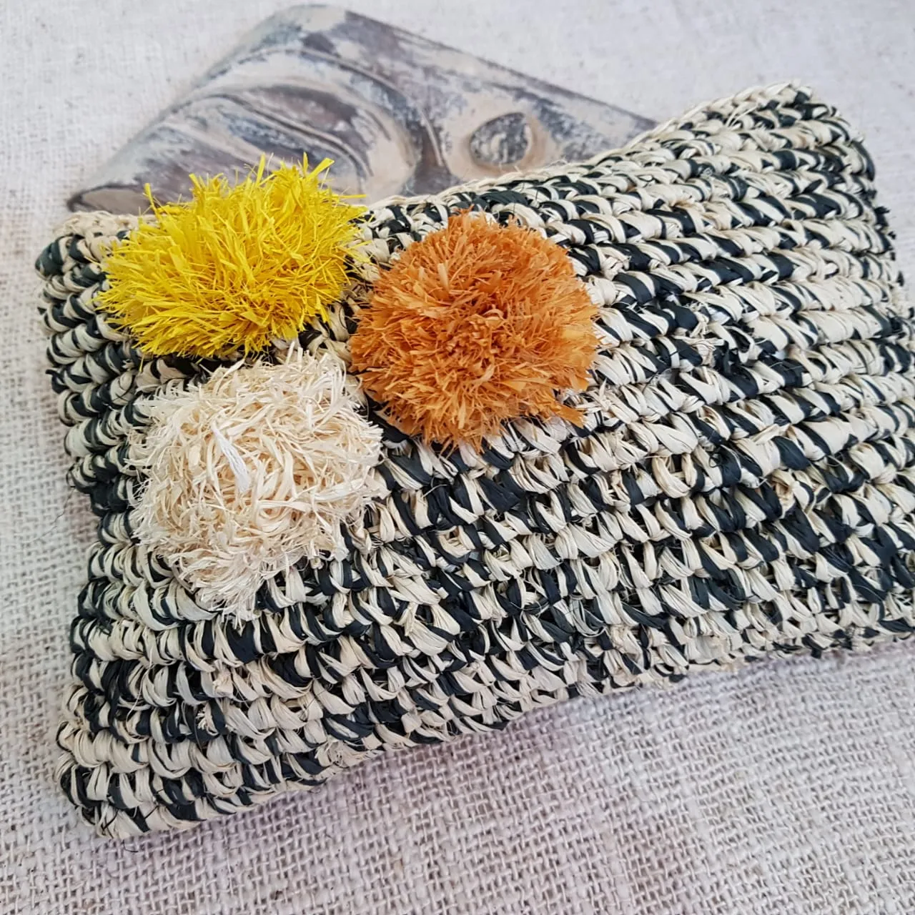 Black & White Woven Straw Grass Clutch With Pom Poms