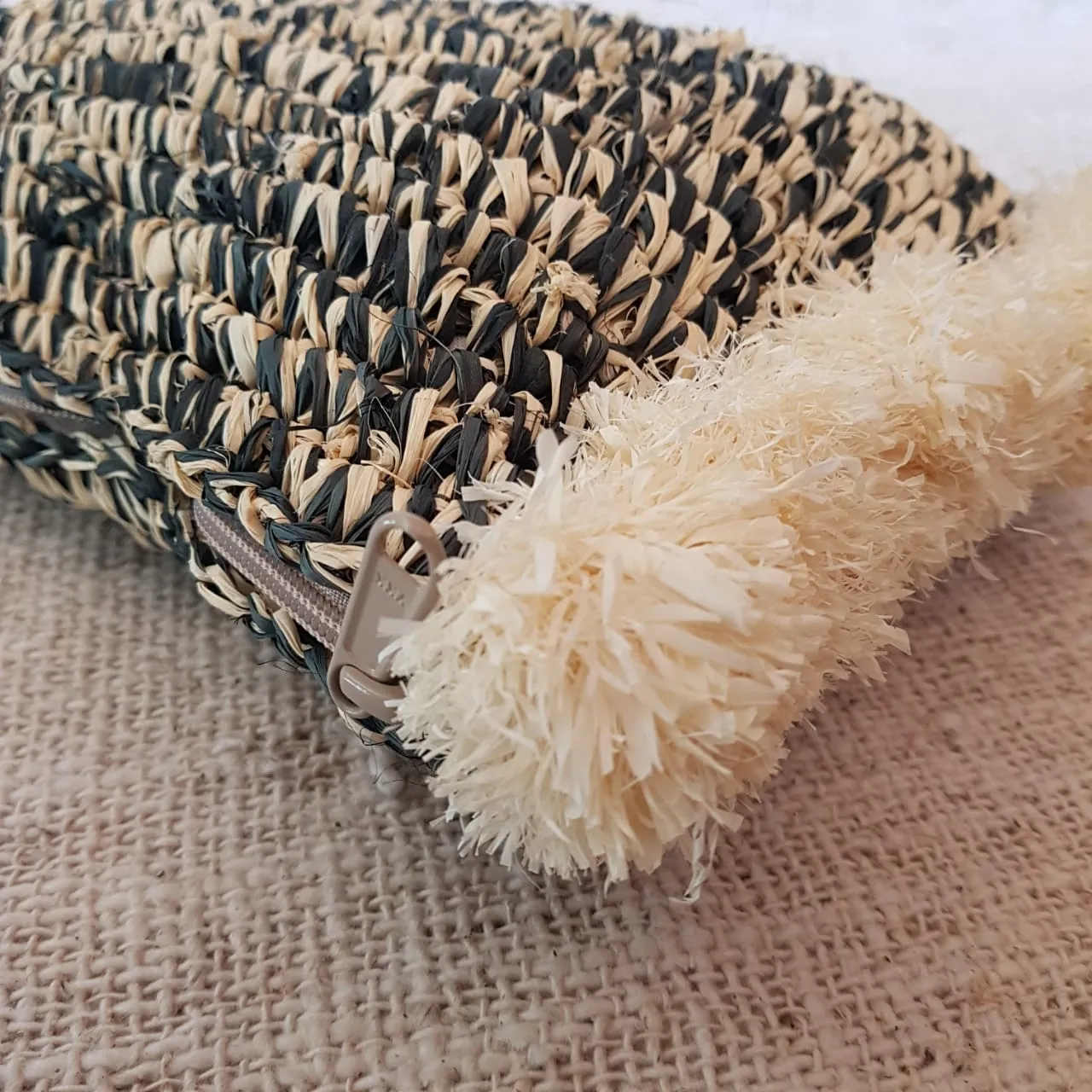 Black & White Woven Straw Grass Clutch With Side Pom Poms